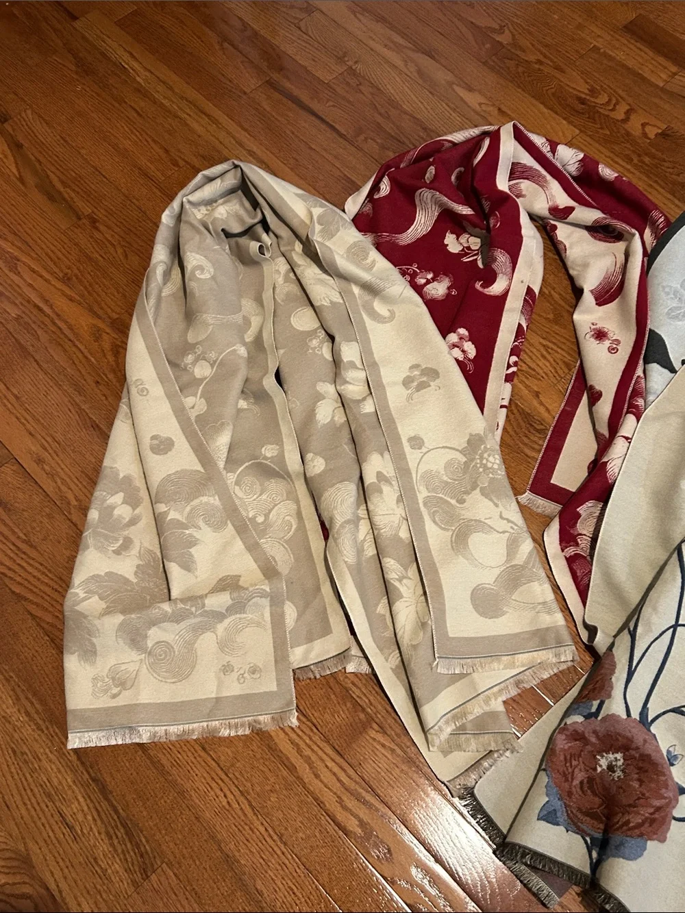Bundle of 4 floral-printed faux cashmere scarves featuring delicate fringe trim